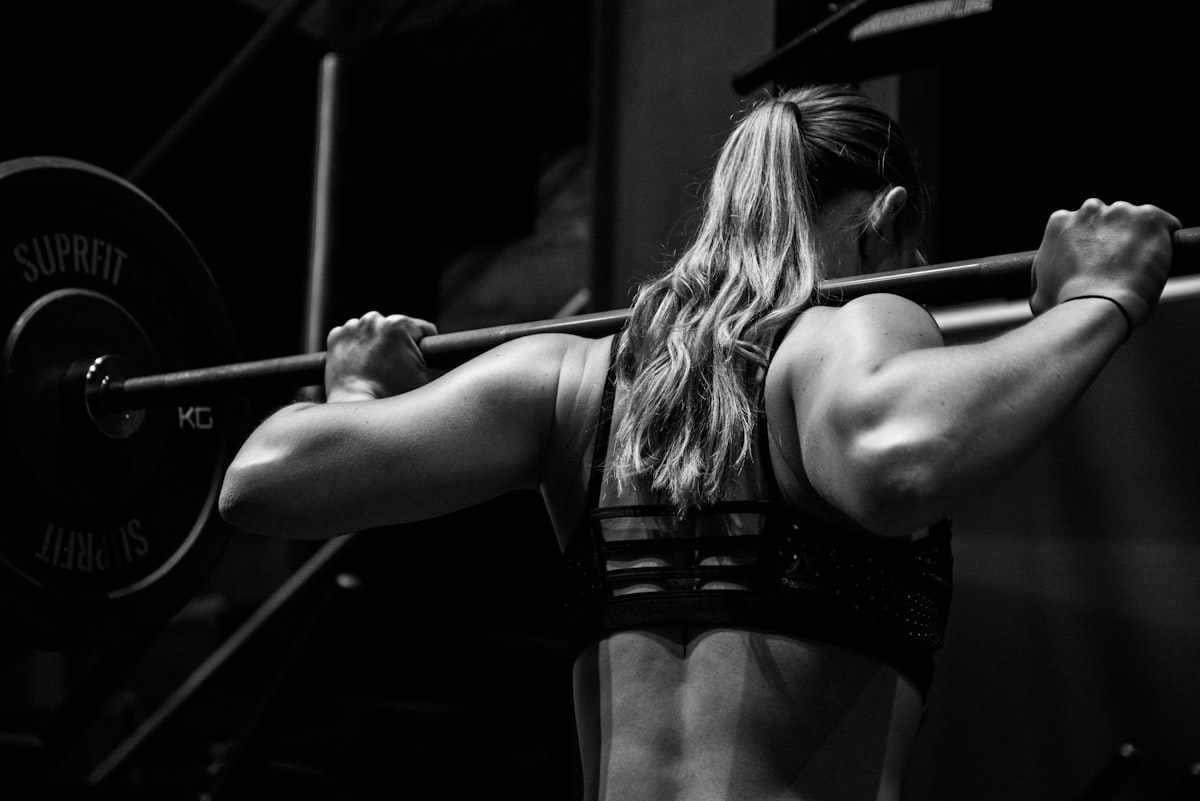 Intense training atmosphere with chalk and barbells